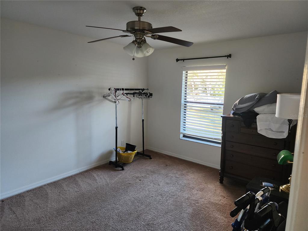 11759 Oswalt Road Clermont, FL 34711 - Photo 20 of 24 a view of a room with gym equipment