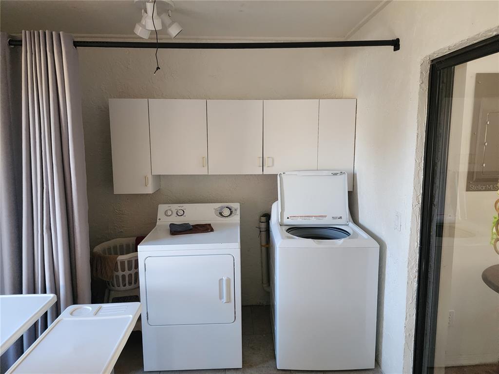 11759 Oswalt Road Clermont, FL 34711 - Photo 23 of 24 a room with storage and utility