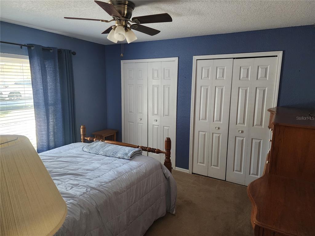 11759 Oswalt Road Clermont, FL 34711 - Photo 5 of 24 a bedroom with a bed and a window