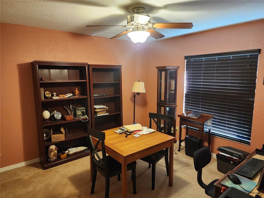 11759 Oswalt Road Clermont, FL 34711 - Photo 6 of 24 a view of a livingroom with furniture and chandelier
