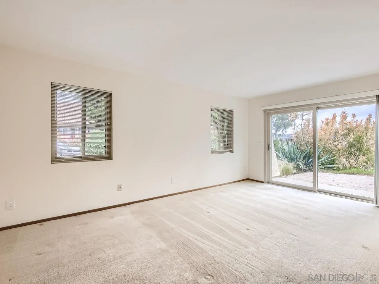 124 Candy Lane Encinitas, CA 92024 - Photo 15 of 27 an empty room with windows