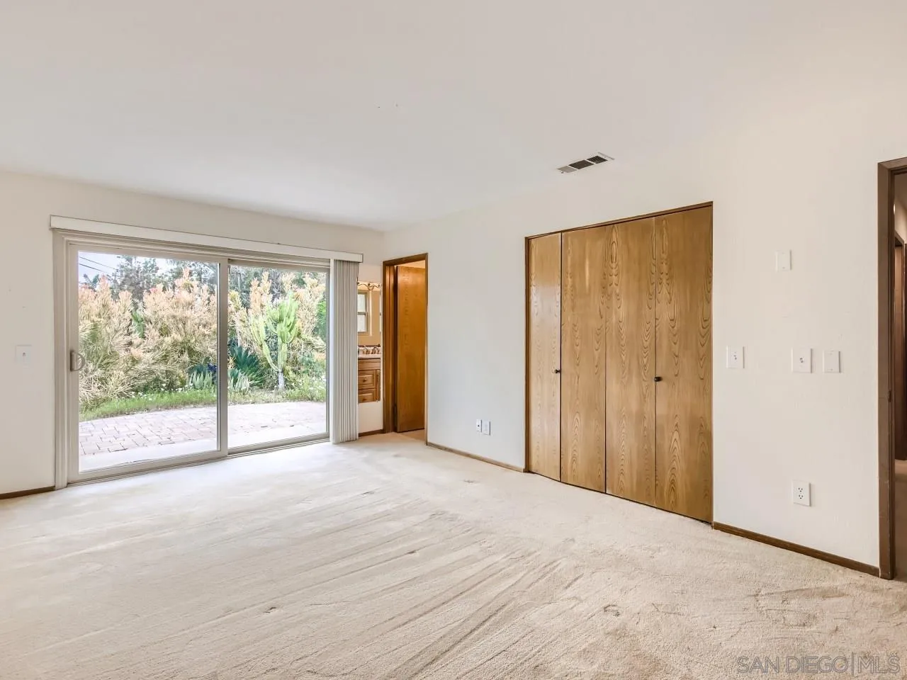 124 Candy Lane Encinitas, CA 92024 - Photo 16 of 27 a view of a big room with windows and view of an empty room