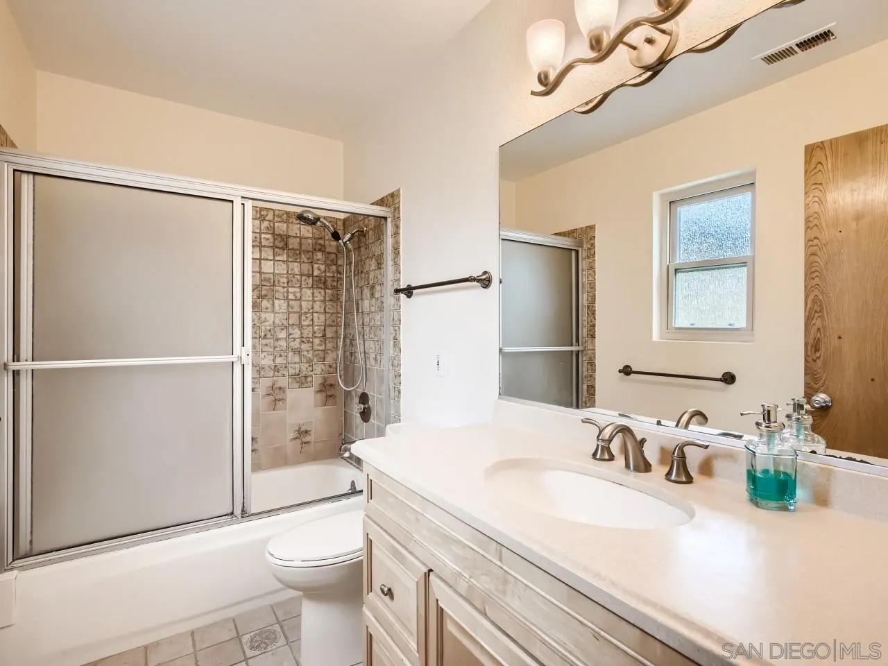 124 Candy Lane Encinitas, CA 92024 - Photo 18 of 27 a bathroom with a sink a toilet and shower