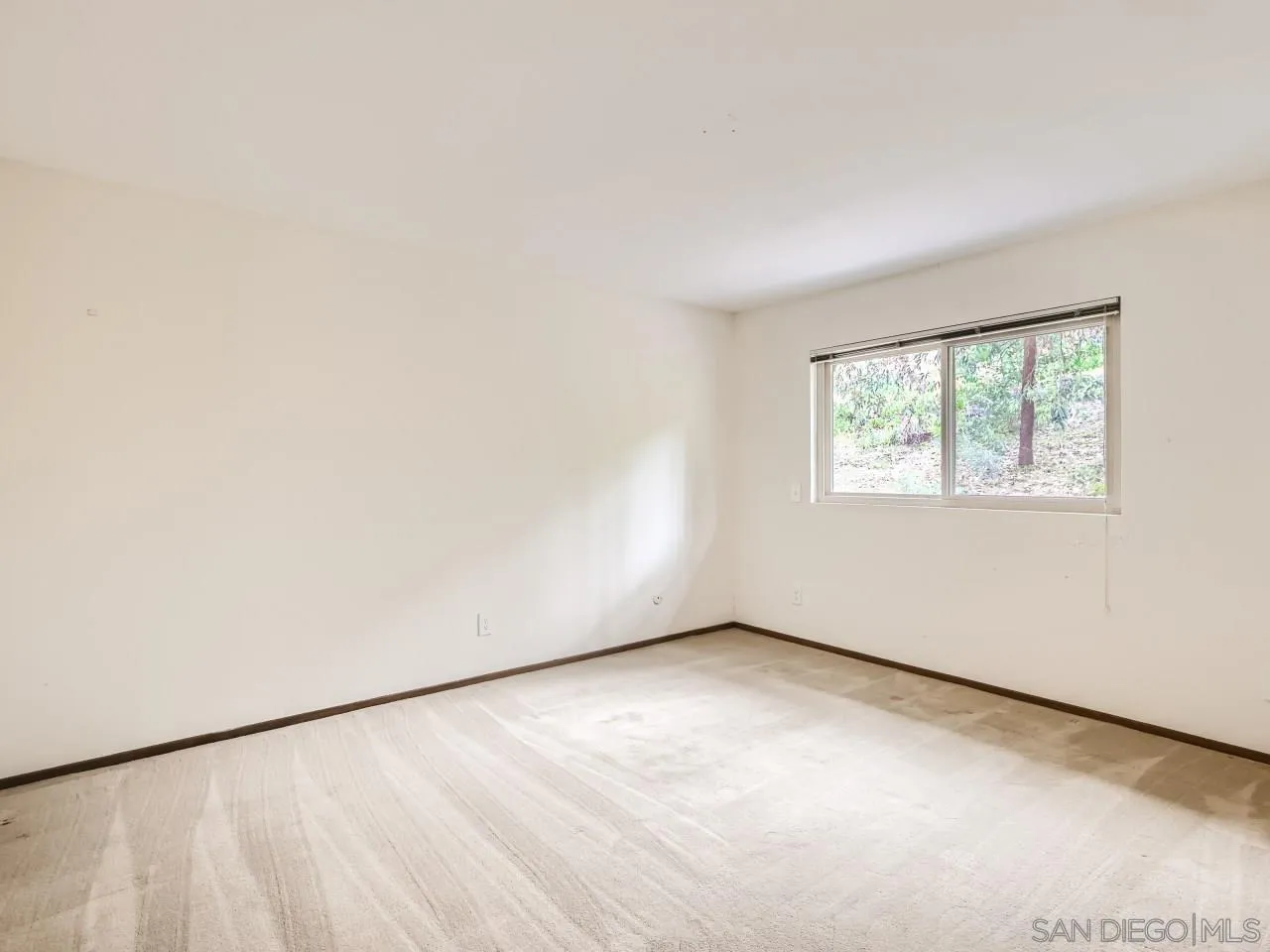 124 Candy Lane Encinitas, CA 92024 - Photo 20 of 27 an empty room with a window