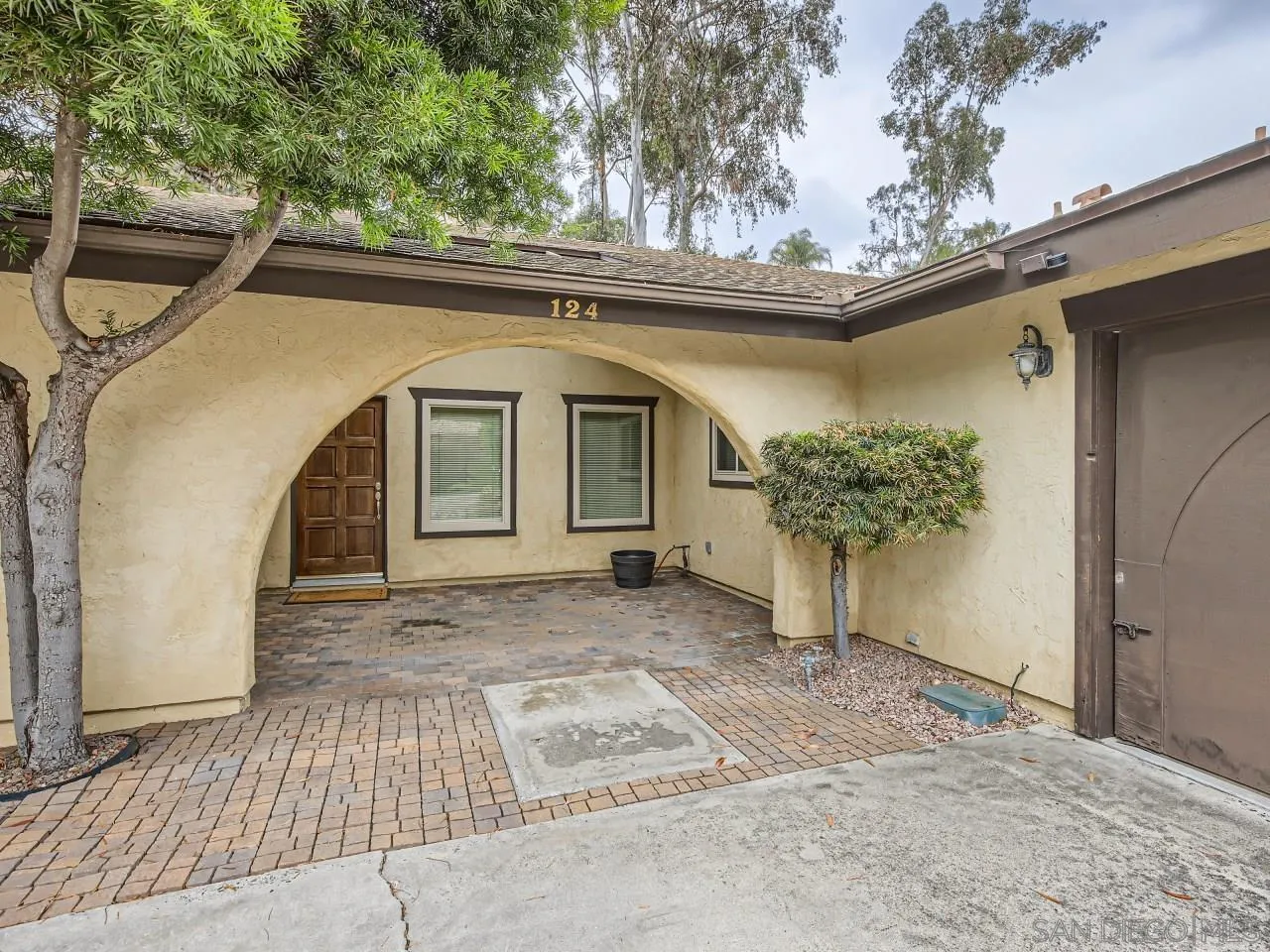 124 Candy Lane Encinitas, CA 92024 - Photo 2 of 27 a front view of a house with garden