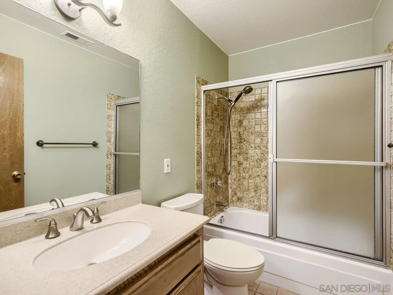 124 Candy Lane Encinitas, CA 92024 - Photo 22 of 27 a bathroom with a sink toilet and shower