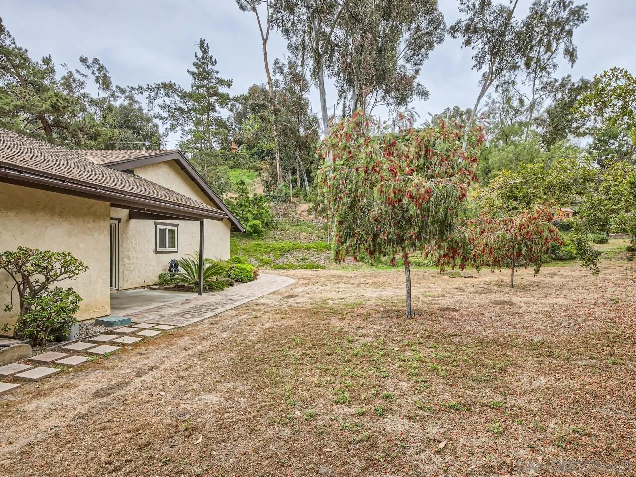124 Candy Lane Encinitas, CA 92024 - Photo 4 of 27 a white house that has a tree in front of it