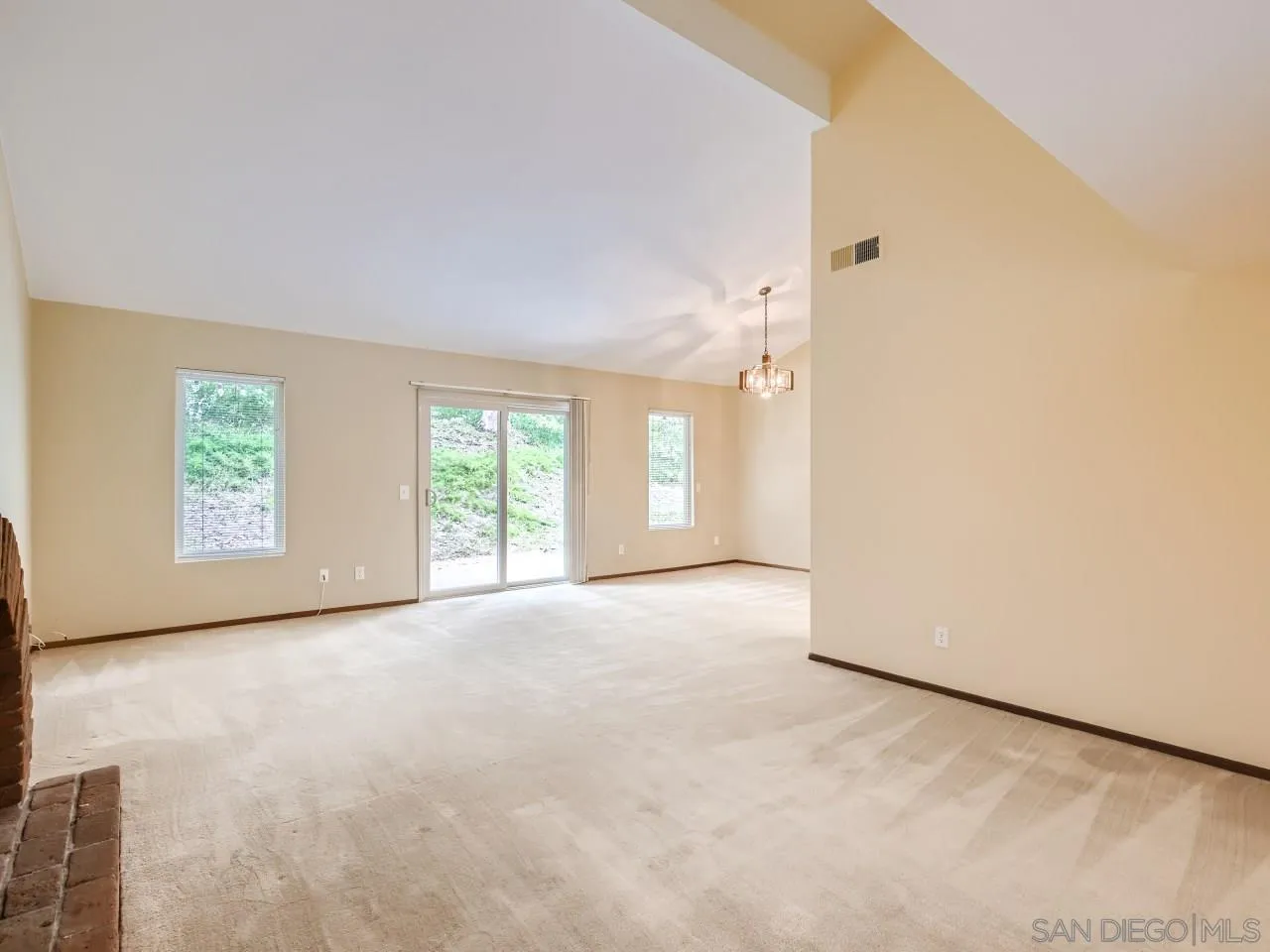 124 Candy Lane Encinitas, CA 92024 - Photo 6 of 27 an empty room with windows