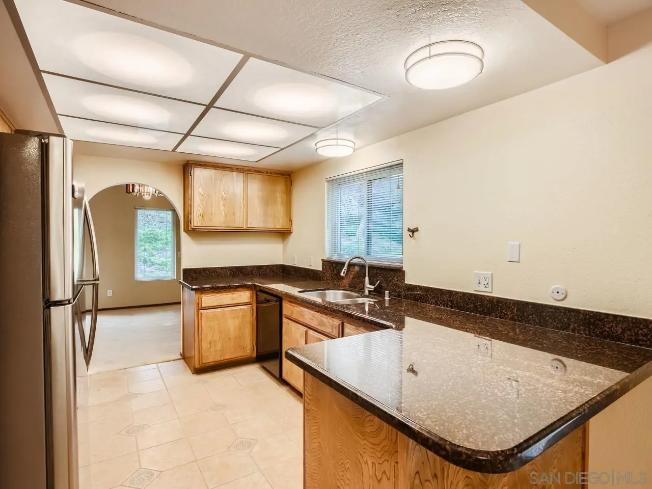 124 Candy Lane Encinitas, CA 92024 - Photo 8 of 27 a kitchen with a sink appliances and cabinets