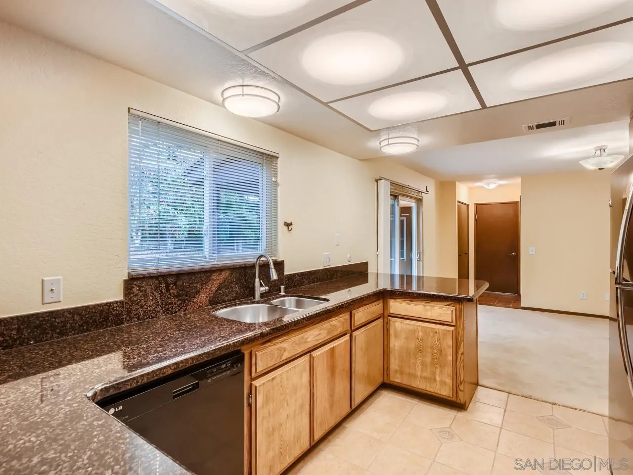 124 Candy Lane Encinitas, CA 92024 - Photo 9 of 27 a kitchen with granite countertop a sink and a counter top space