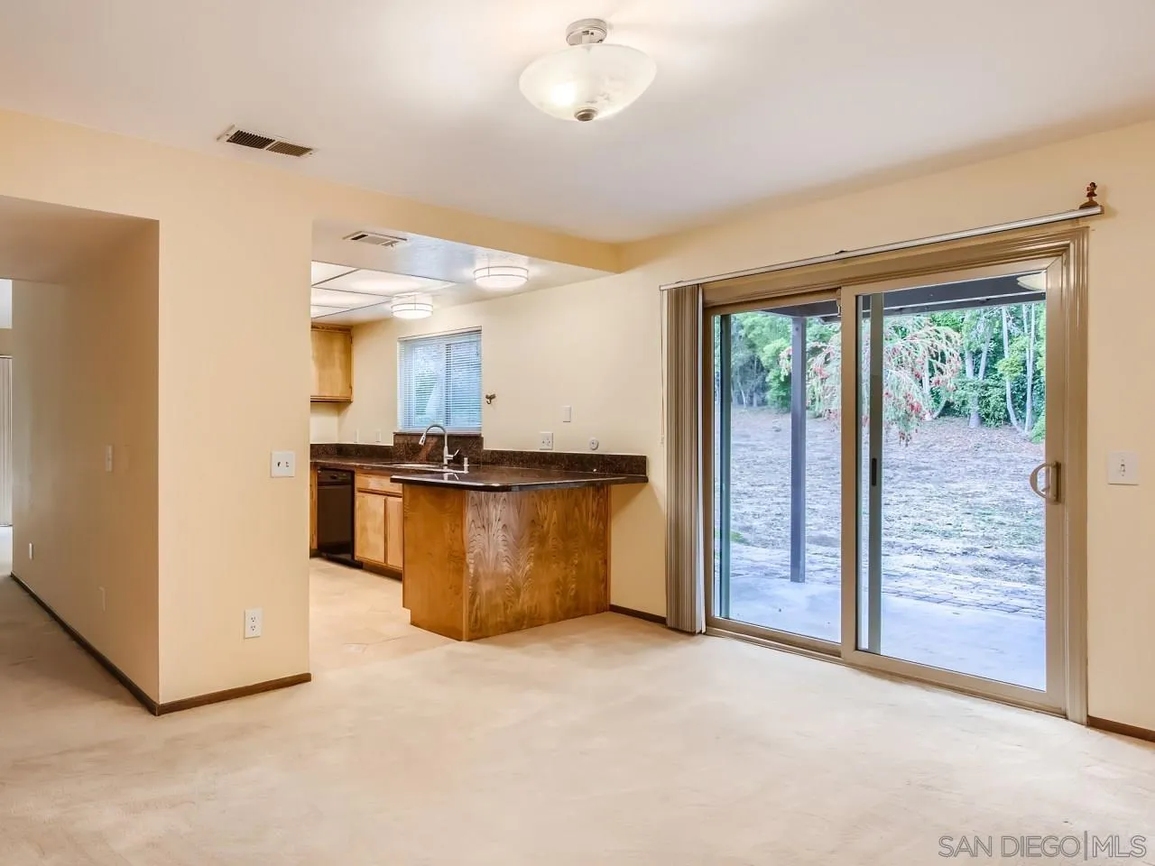 124 Candy Lane Encinitas, CA 92024 - Photo 10 of 27 a view of kitchen with refrigerator and window