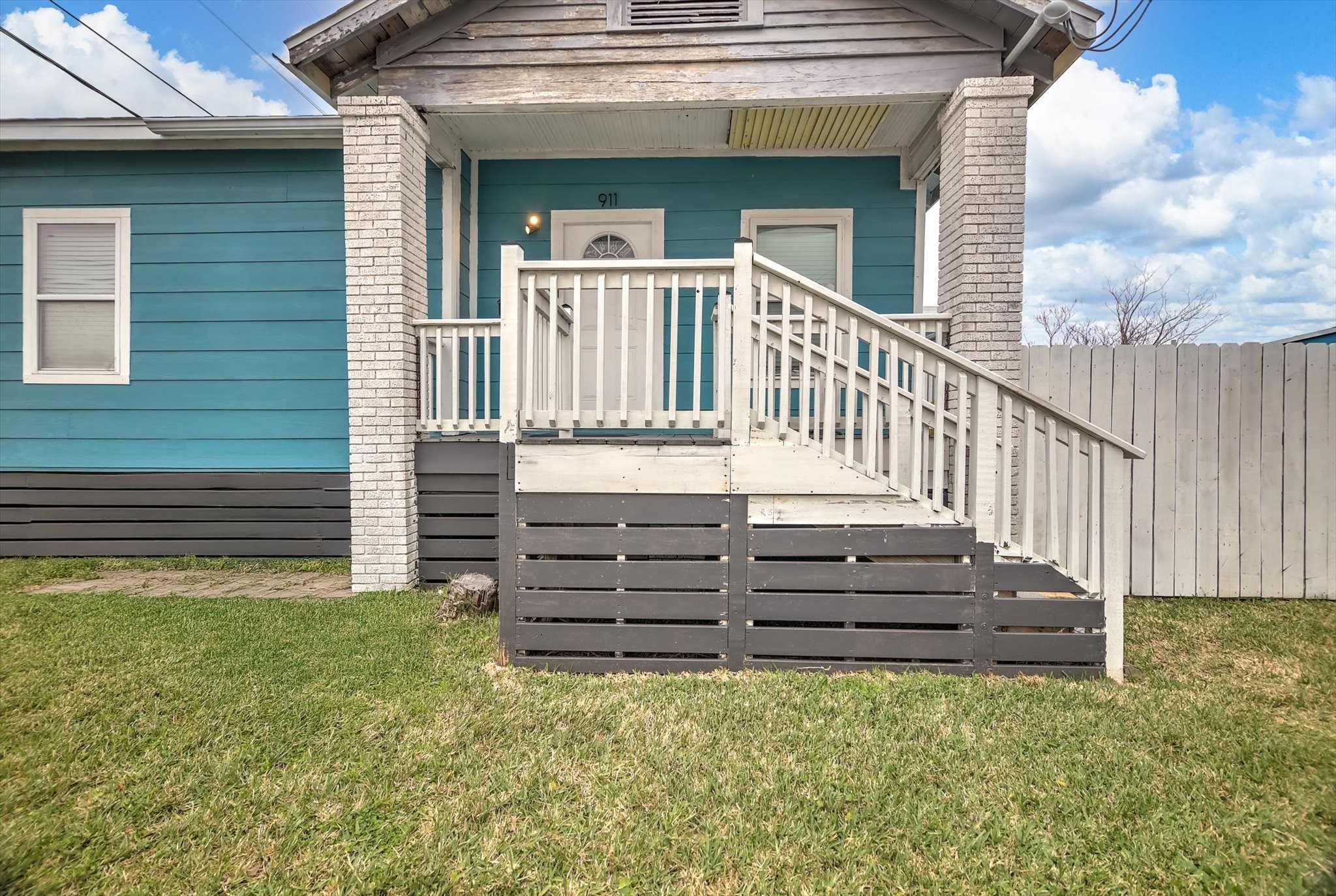 905 43rd Street Galveston, TX 77550 - Photo 23 of 43 Charming and inviting, this front porch at 911 43rd St offers a perfect blend of classic appeal and modern comfort, ideal for relaxing evenings and welcoming guests.