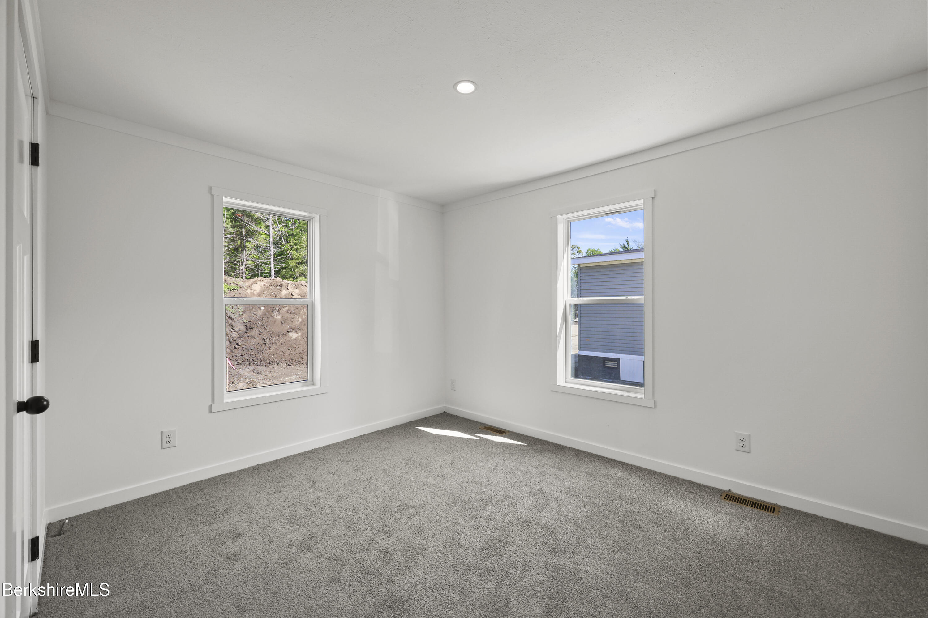 395 Cheshire Road, Unit 102 Pittsfield, MA 01201 - Photo 22 of 28 an empty room with windows