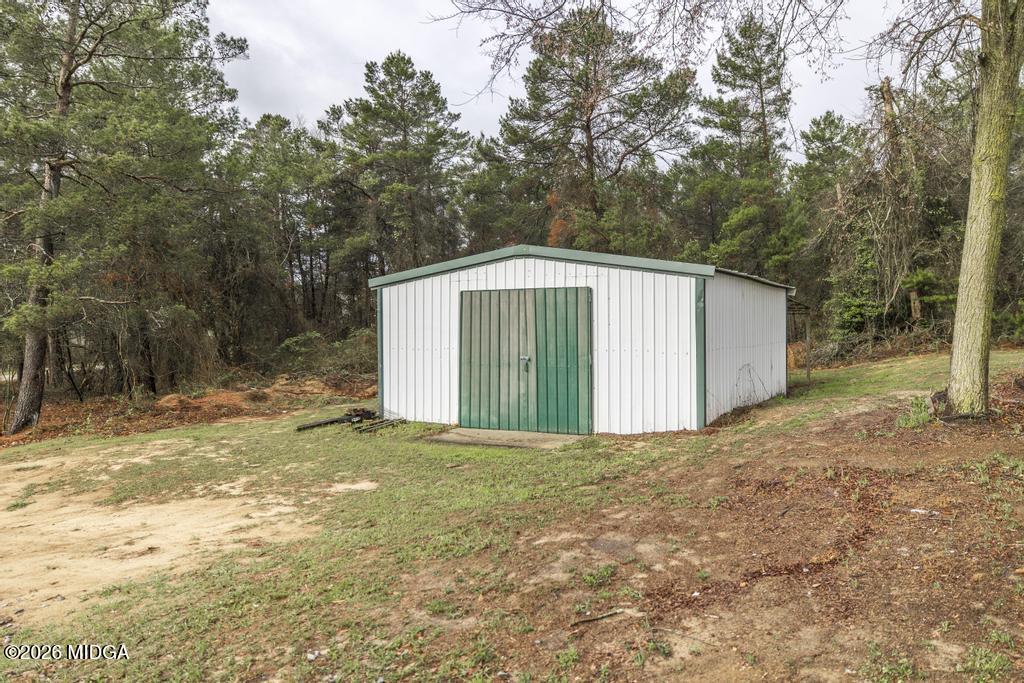 319 Pope Road Roberta, GA 31078 - Photo 38 of 42 a view of a house with a yard and large tree