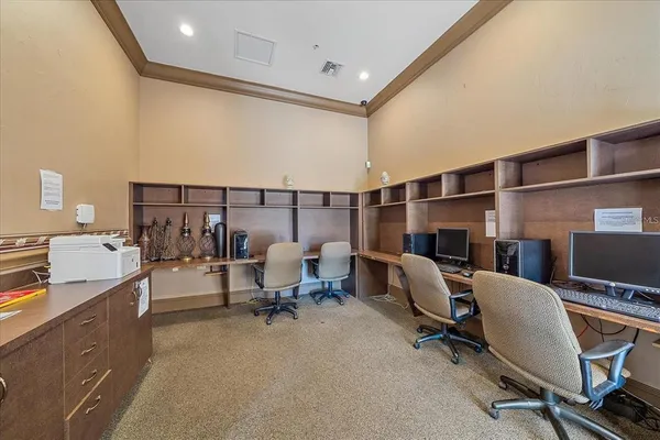 a view of a workspace with furniture