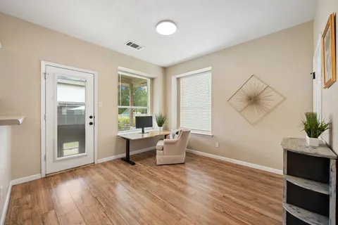 a living room with furniture and a window