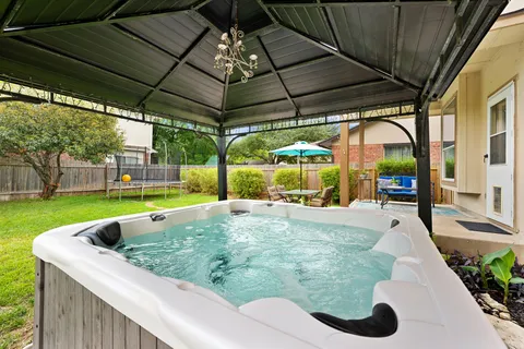 a view of a backyard with sitting area