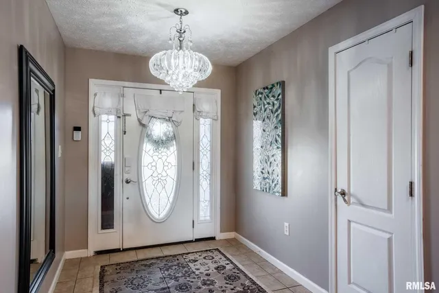 a view of dining room with chandelier