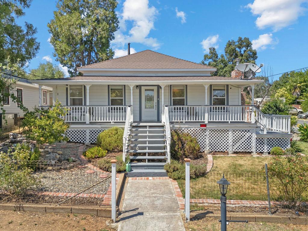 a front view of a house with garden
