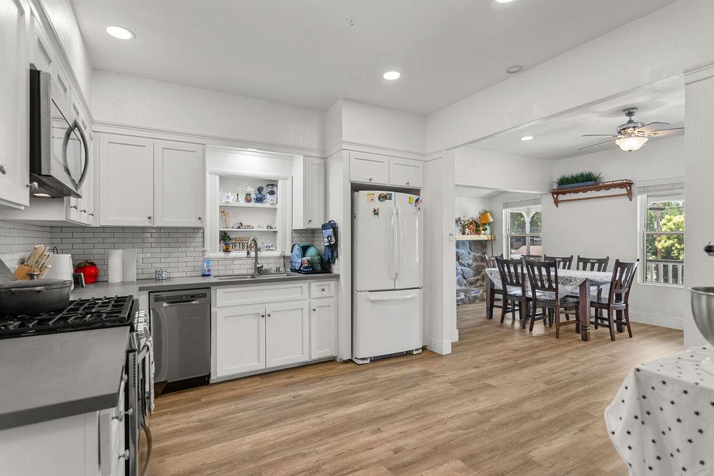 18110 4th Avenue Jamestown, CA 95327 - Photo 15 of 37 a kitchen that has a lot of cabinets a sink and appliances in it
