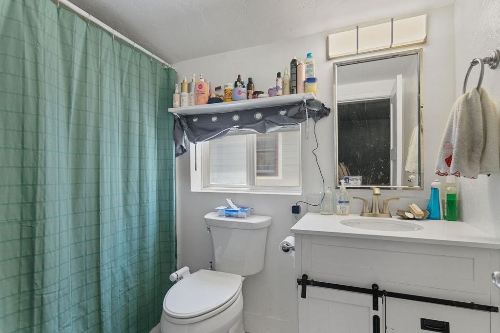 18110 4th Avenue Jamestown, CA 95327 - Photo 20 of 37 a bathroom with a sink a toilet and a mirror