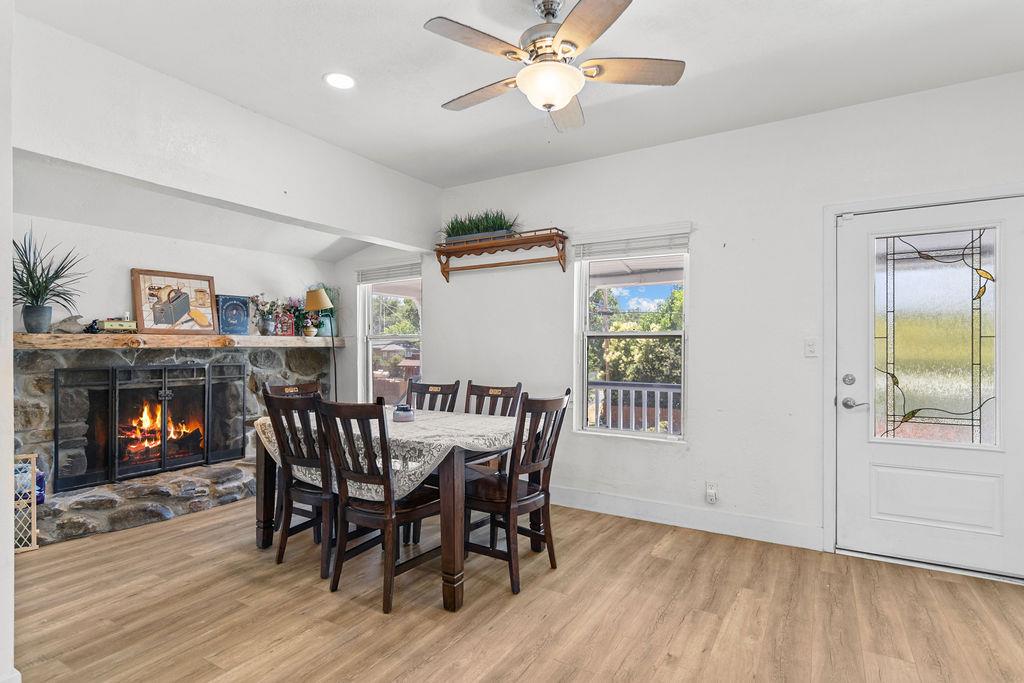 18110 4th Avenue Jamestown, CA 95327 - Photo 9 of 37 a view of a dining room with furniture and wooden floor
