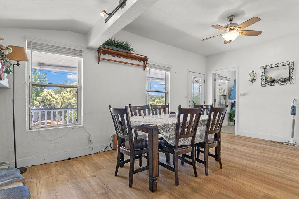 18110 4th Avenue Jamestown, CA 95327 - Photo 10 of 37 a view of a dining room with furniture window and wooden floor