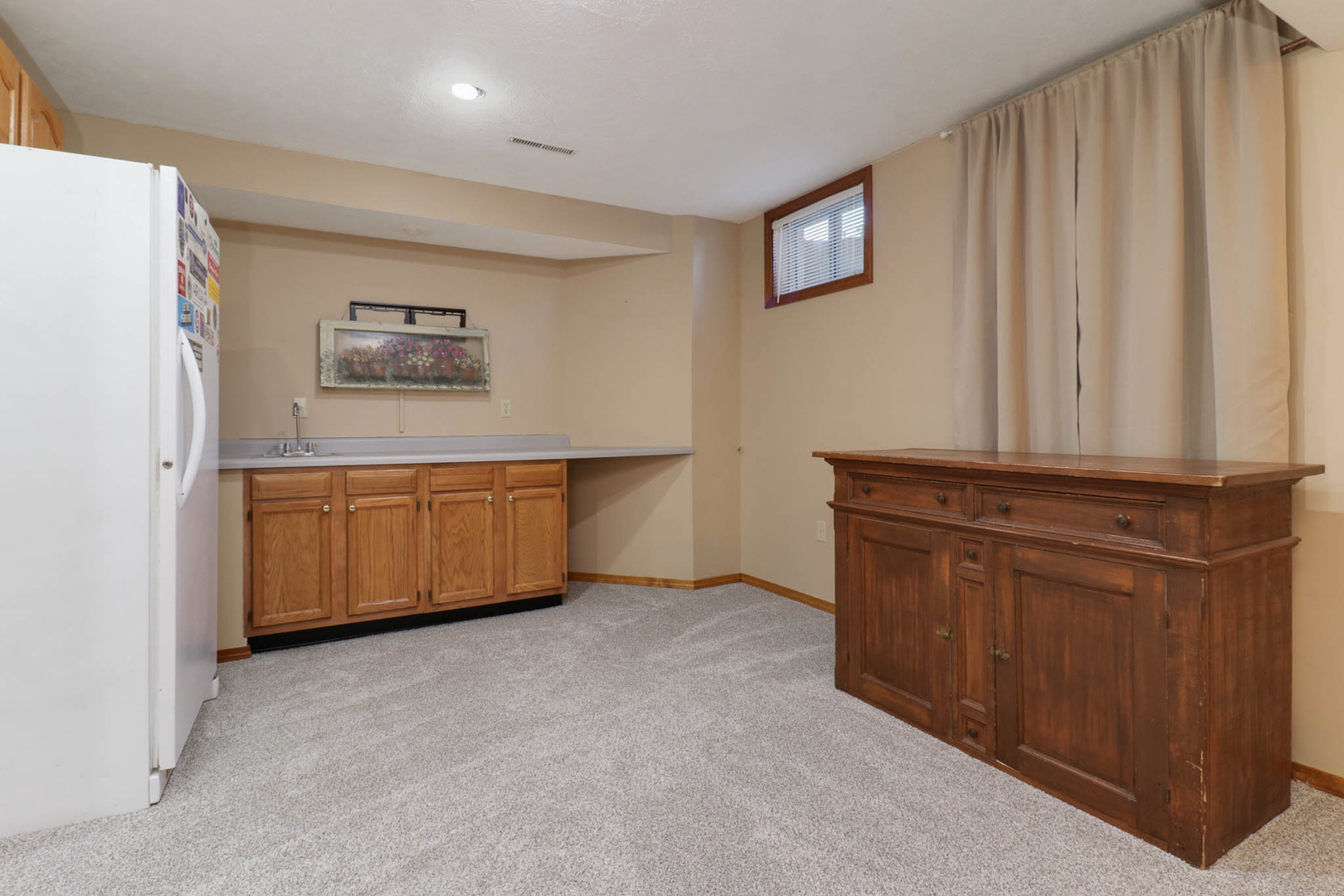 3203 Eagle Crest Road Bloomington, IL 61704 - Photo 35 of 52 a view of kitchen with cabinets and wooden floor