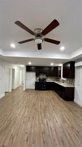 a view of kitchen with refrigerator and window