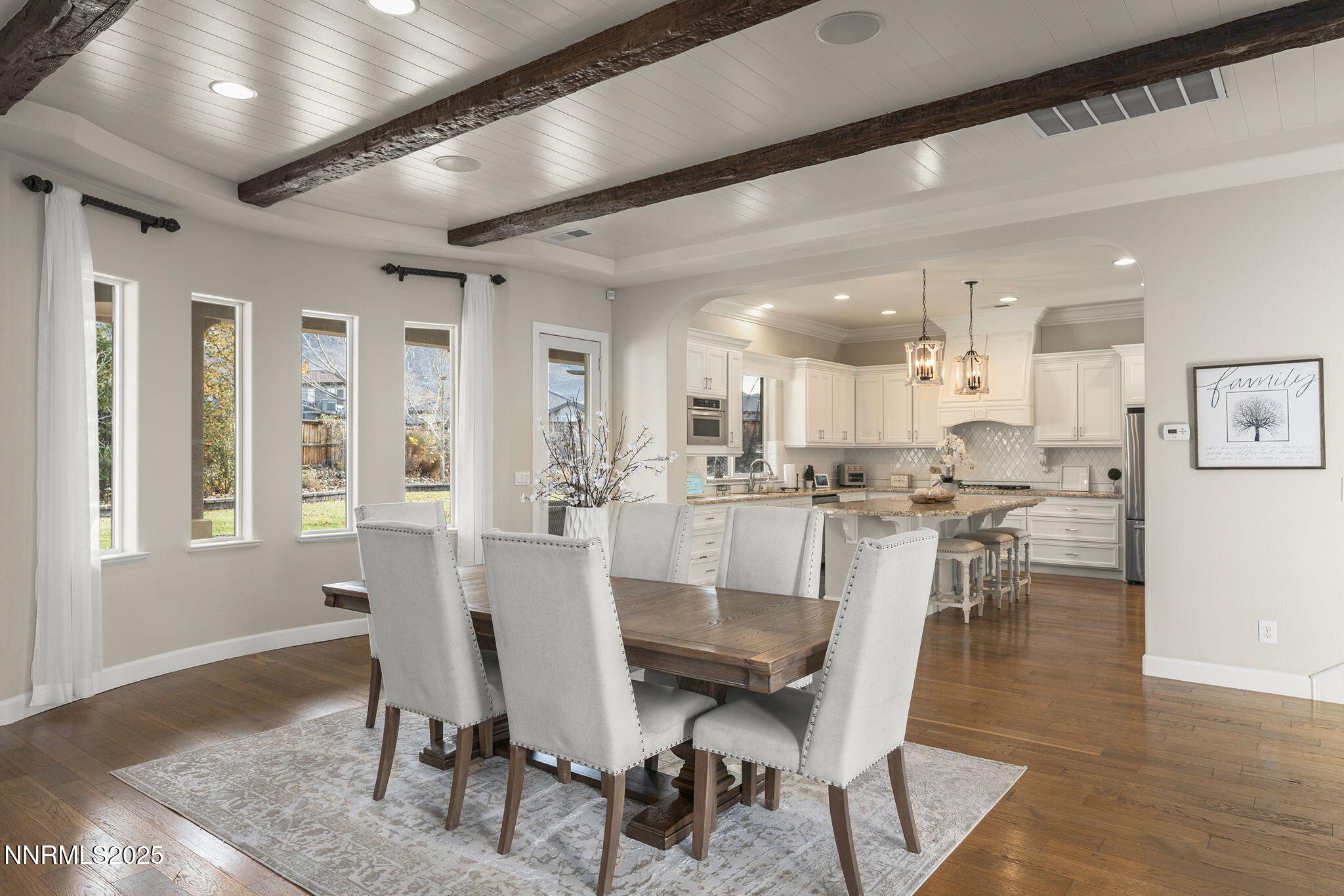 9890 Kerrydale Court Reno, NV 89521 - Photo 13 of 48 a view of a dining room with furniture and wooden floor