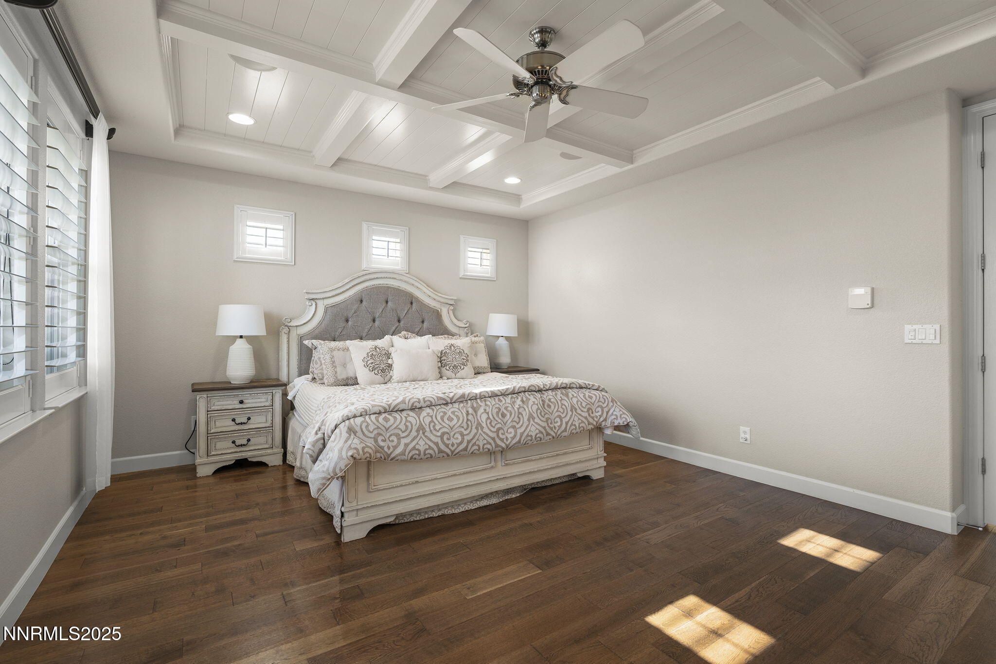 9890 Kerrydale Court Reno, NV 89521 - Photo 22 of 48 a bedroom with a bed and a chandelier