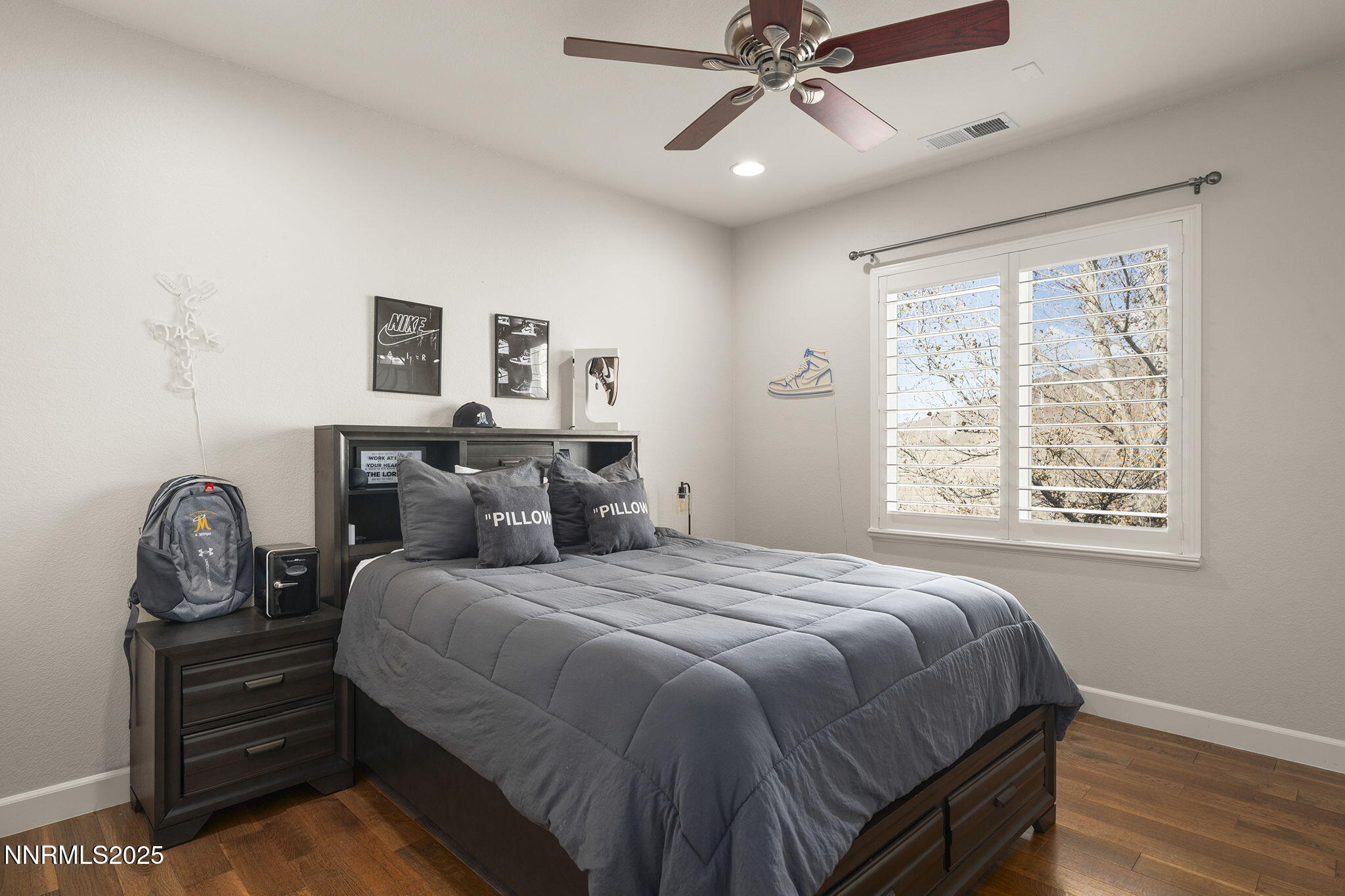 9890 Kerrydale Court Reno, NV 89521 - Photo 32 of 48 a bedroom with a bed and a chandelier