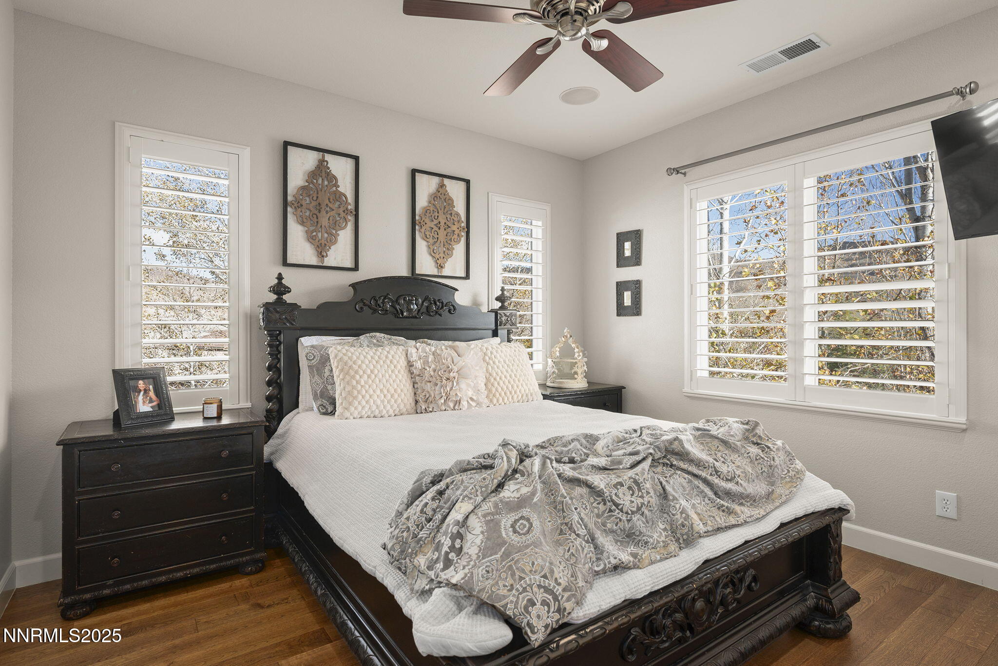 9890 Kerrydale Court Reno, NV 89521 - Photo 34 of 48 a bed sitting in a bedroom next to a window