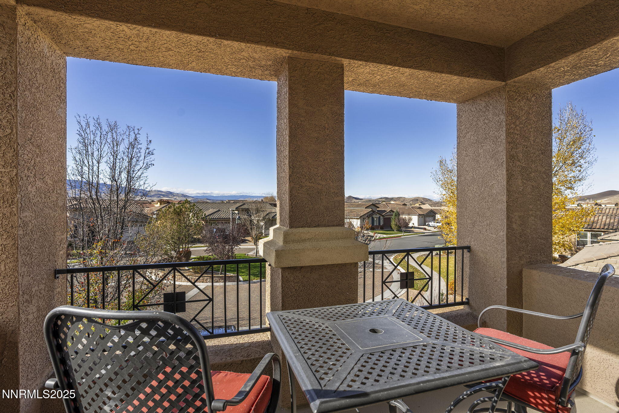 9890 Kerrydale Court Reno, NV 89521 - Photo 37 of 48 a table and chairs in a balcony