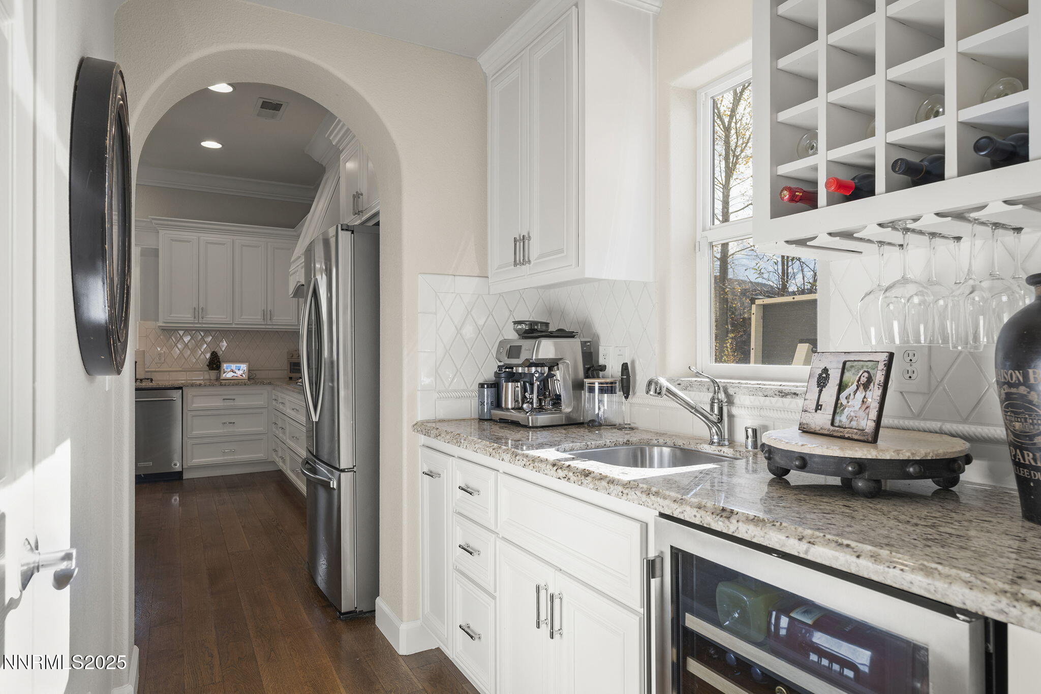 9890 Kerrydale Court Reno, NV 89521 - Photo 7 of 48 a kitchen with granite countertop a sink stove and refrigerator