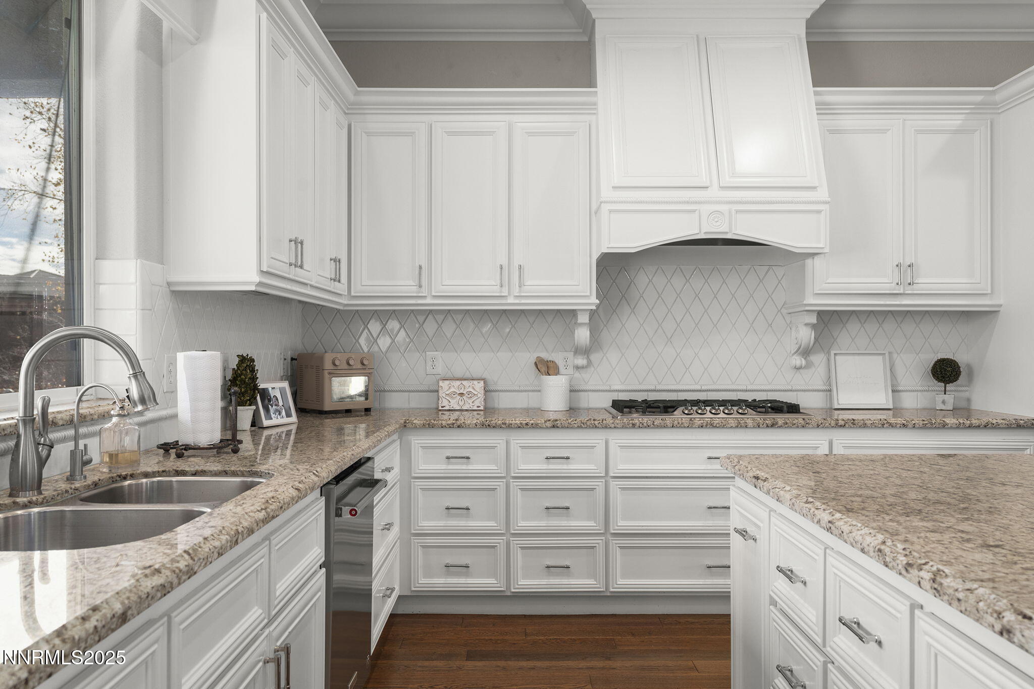 9890 Kerrydale Court Reno, NV 89521 - Photo 9 of 48 a kitchen with granite countertop a sink stove and cabinets