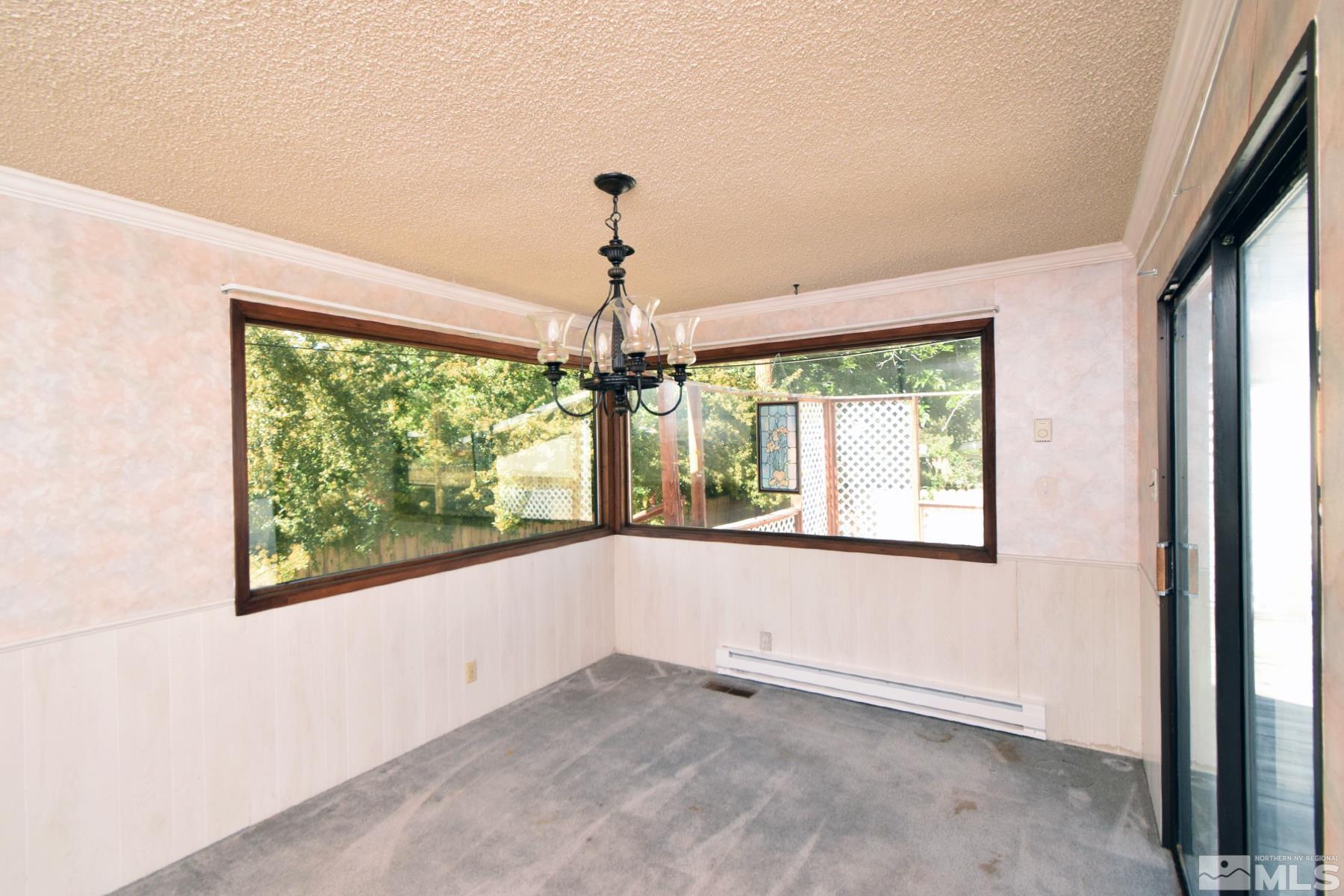 1279 Ebbetts Drive Reno, NV 89503 - Photo 16 of 37 an empty room with windows and outdoor view