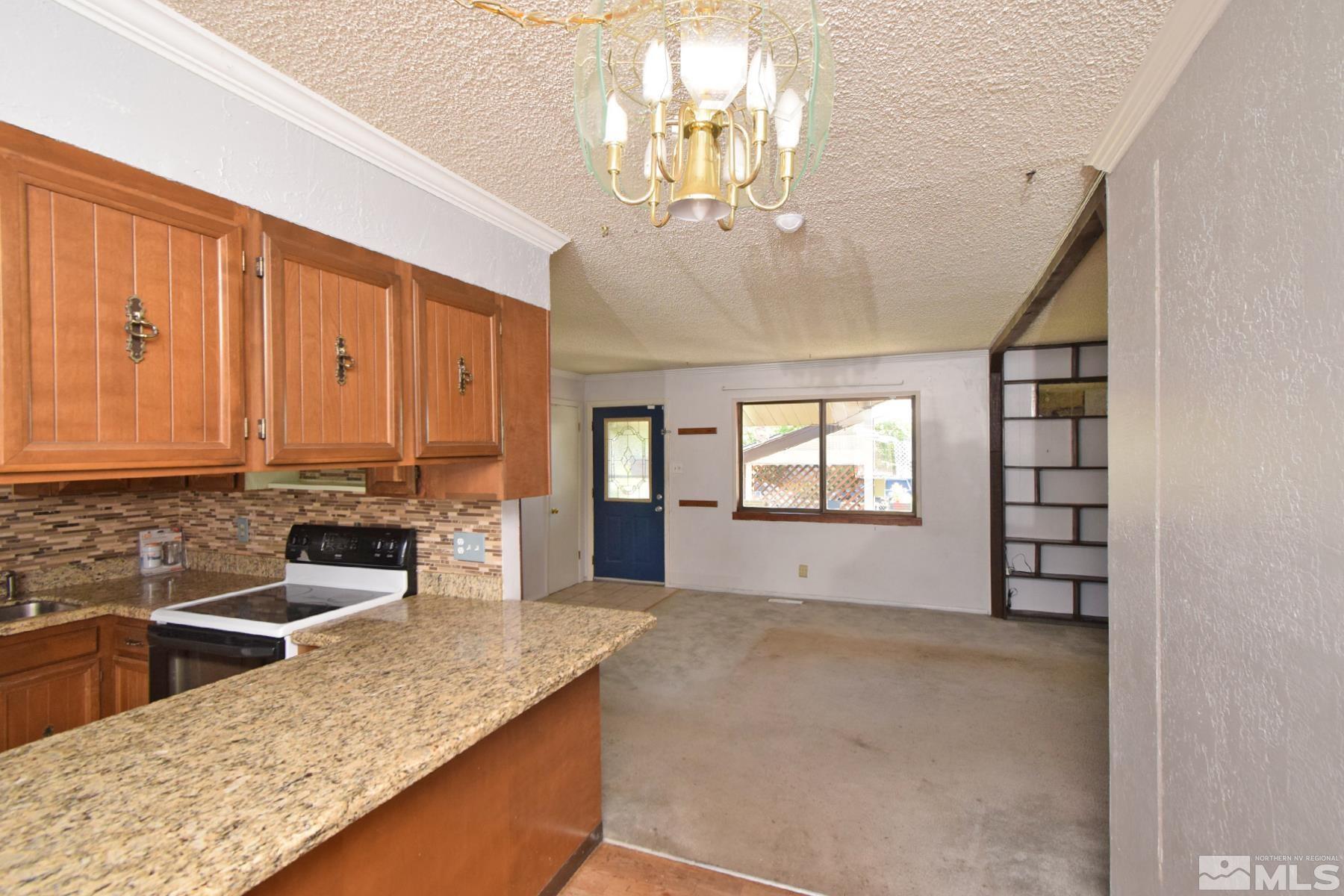 1279 Ebbetts Drive Reno, NV 89503 - Photo 20 of 37 a view of a kitchen with a sink and large window