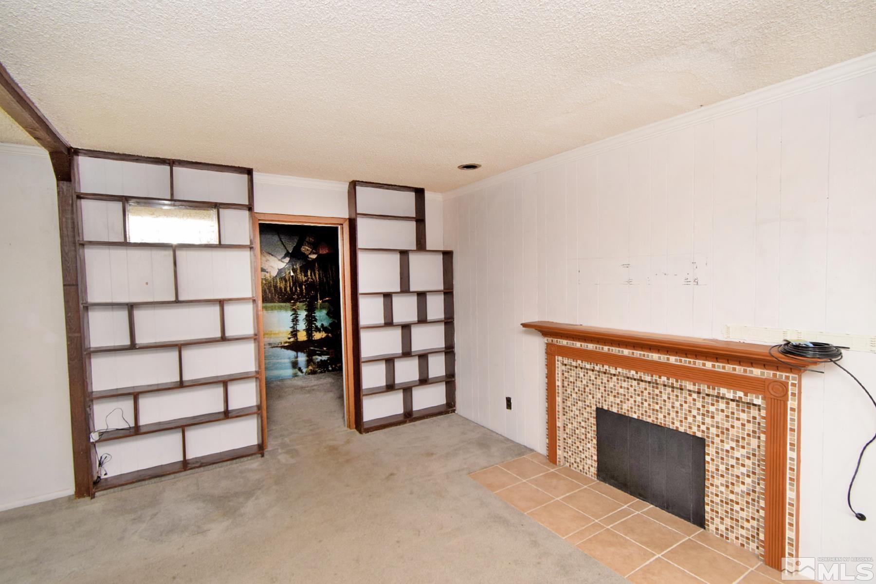 1279 Ebbetts Drive Reno, NV 89503 - Photo 7 of 37 a view of a livingroom with an empty space and a window