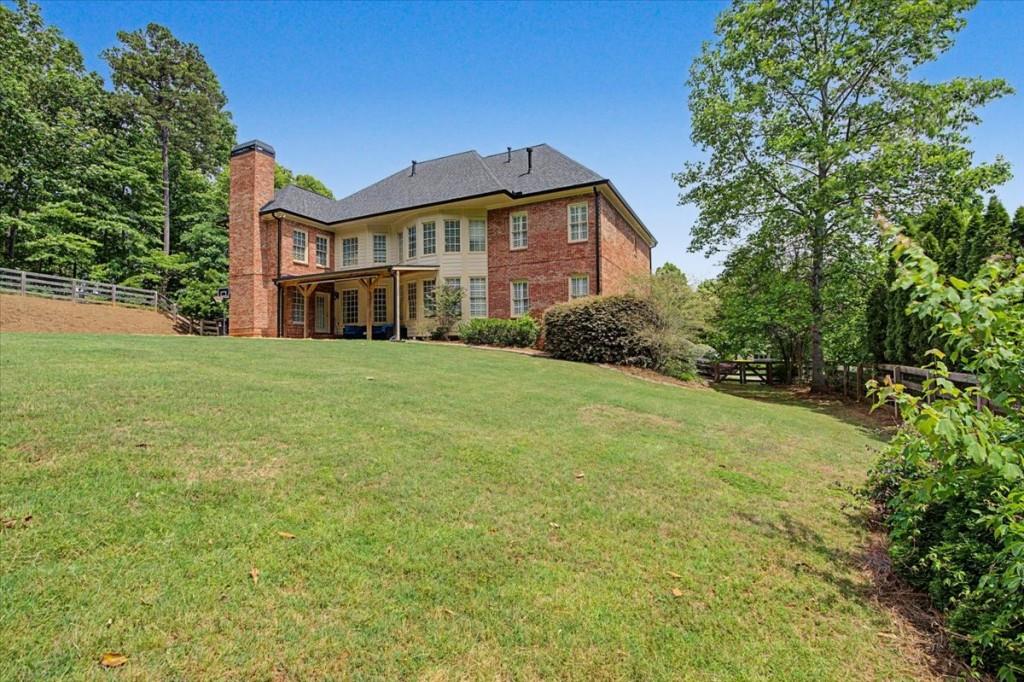 122 Ridge View Drive Ball Ground, GA 30107 - Photo 69 of 84 a front view of a house with yard and green space