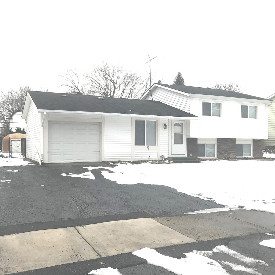 309 Rockhurst Road Bolingbrook, IL 60440 - Photo 1 of 17 a front view of a house with a yard