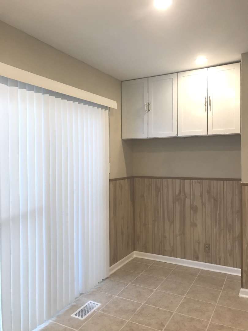 309 Rockhurst Road Bolingbrook, IL 60440 - Photo 7 of 17 a view of an empty room with window
