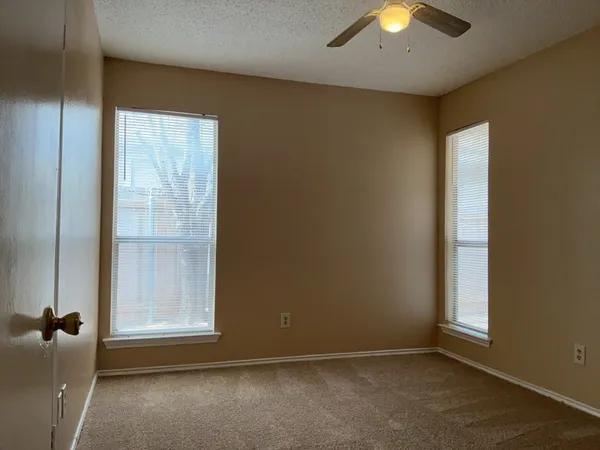 an empty room with a empty space and a window