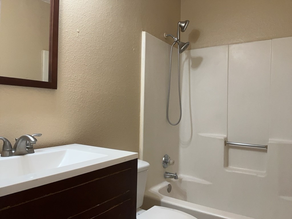 2028 Redwing Way Round Rock, TX 78664 - Photo 13 of 24 a bathroom with a sink and a mirror