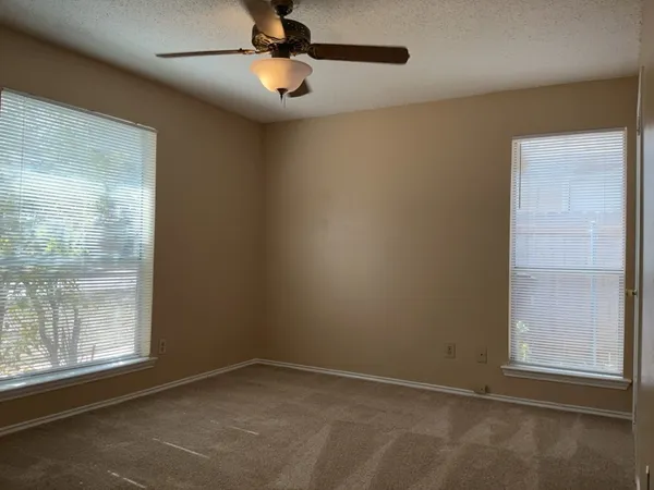 an empty room with a empty space and a window