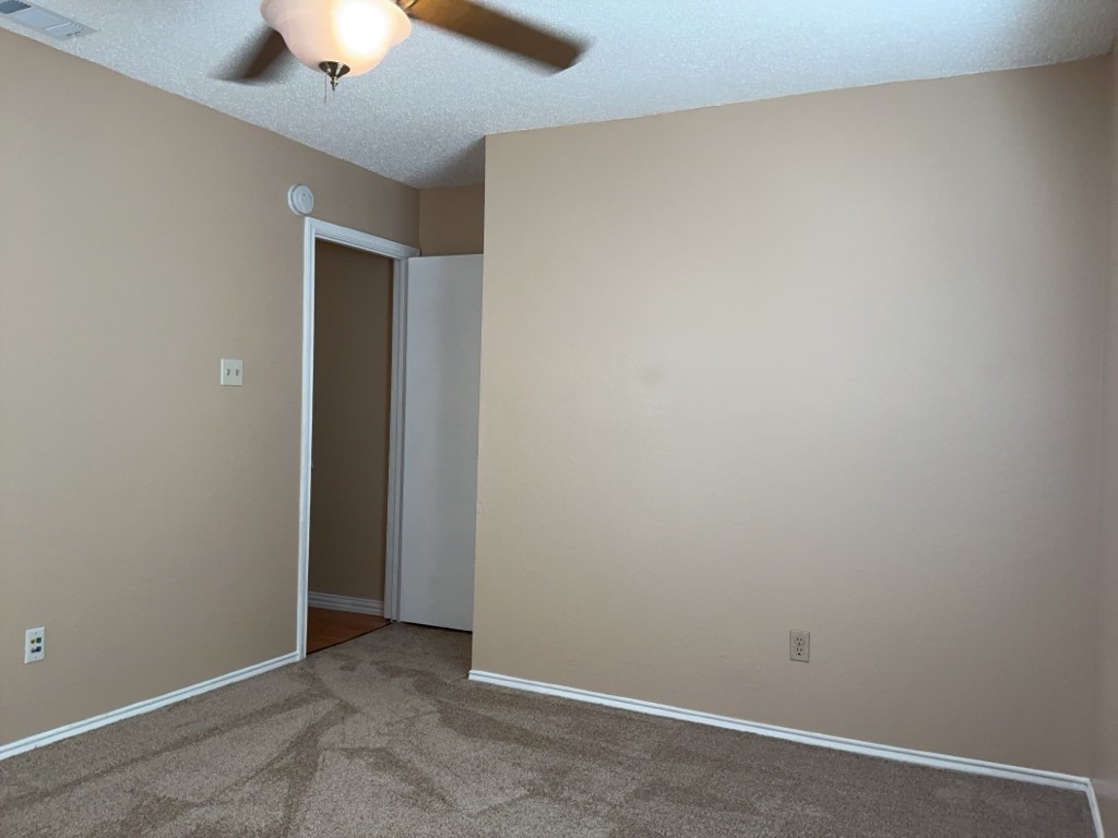2028 Redwing Way Round Rock, TX 78664 - Photo 16 of 24 an empty room with a ceiling fan and a fan