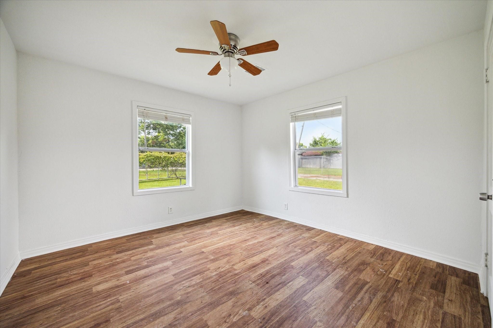 3229 Persimmon Street Houston, TX 77093 - Photo 5 of 8 a view of an empty room with a window