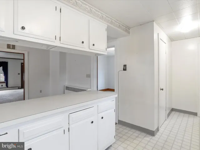 a view of cabinets and closet