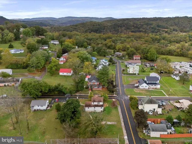 an aerial view of residential house with outdoor space