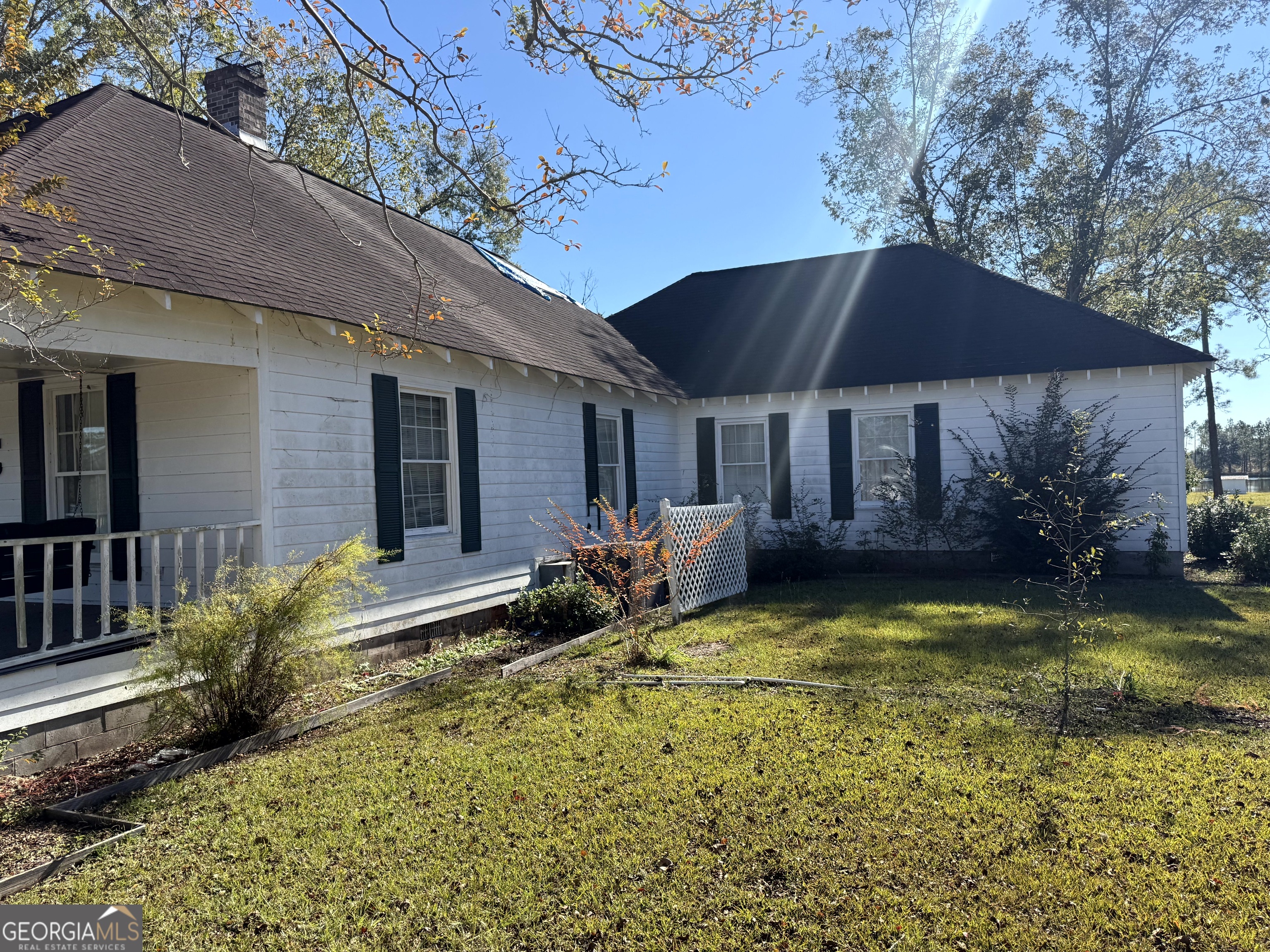 4980 West Broad Street Alston, GA 30410 - Photo 6 of 6 a view of a house with swimming pool and porch with furniture
